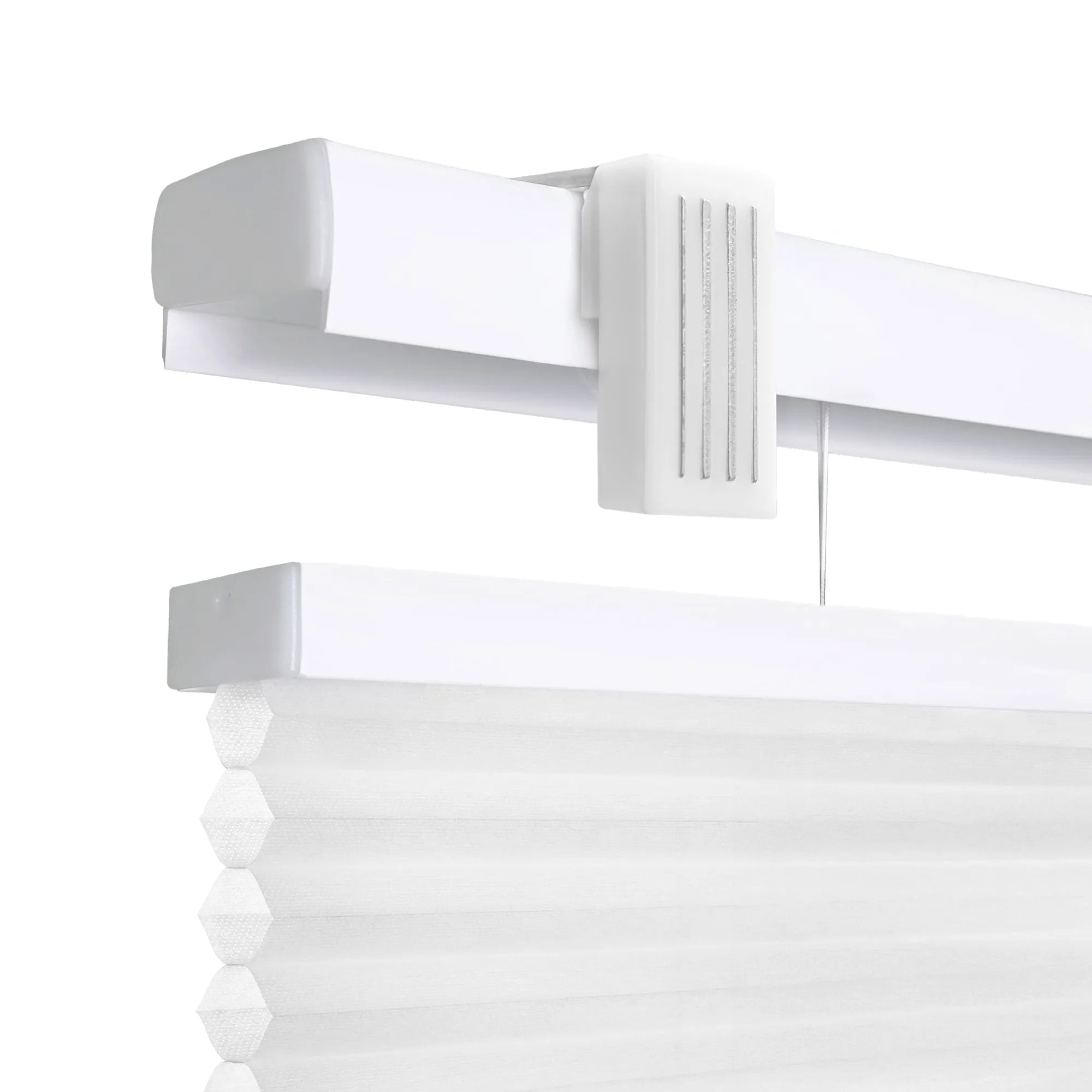 A high-resolution, close-up product shot of white cordless cellular honeycomb shades against a clean white background. The image highlights the top mounting rail and the textured, pleated fabric of the shade, showcasing the &