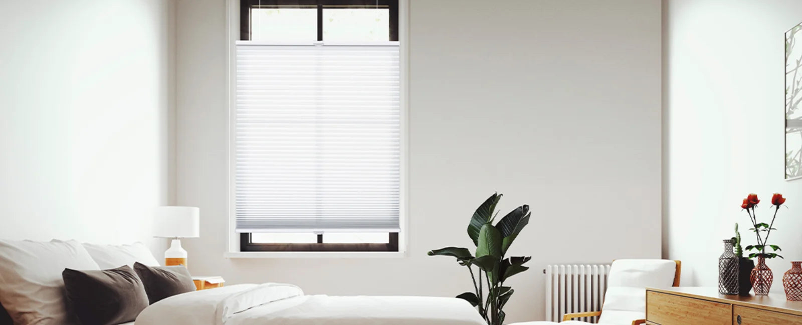 Top down bottom up light filtering cellular shades in a bedroom window, allowing natural light from above while maintaining privacy below