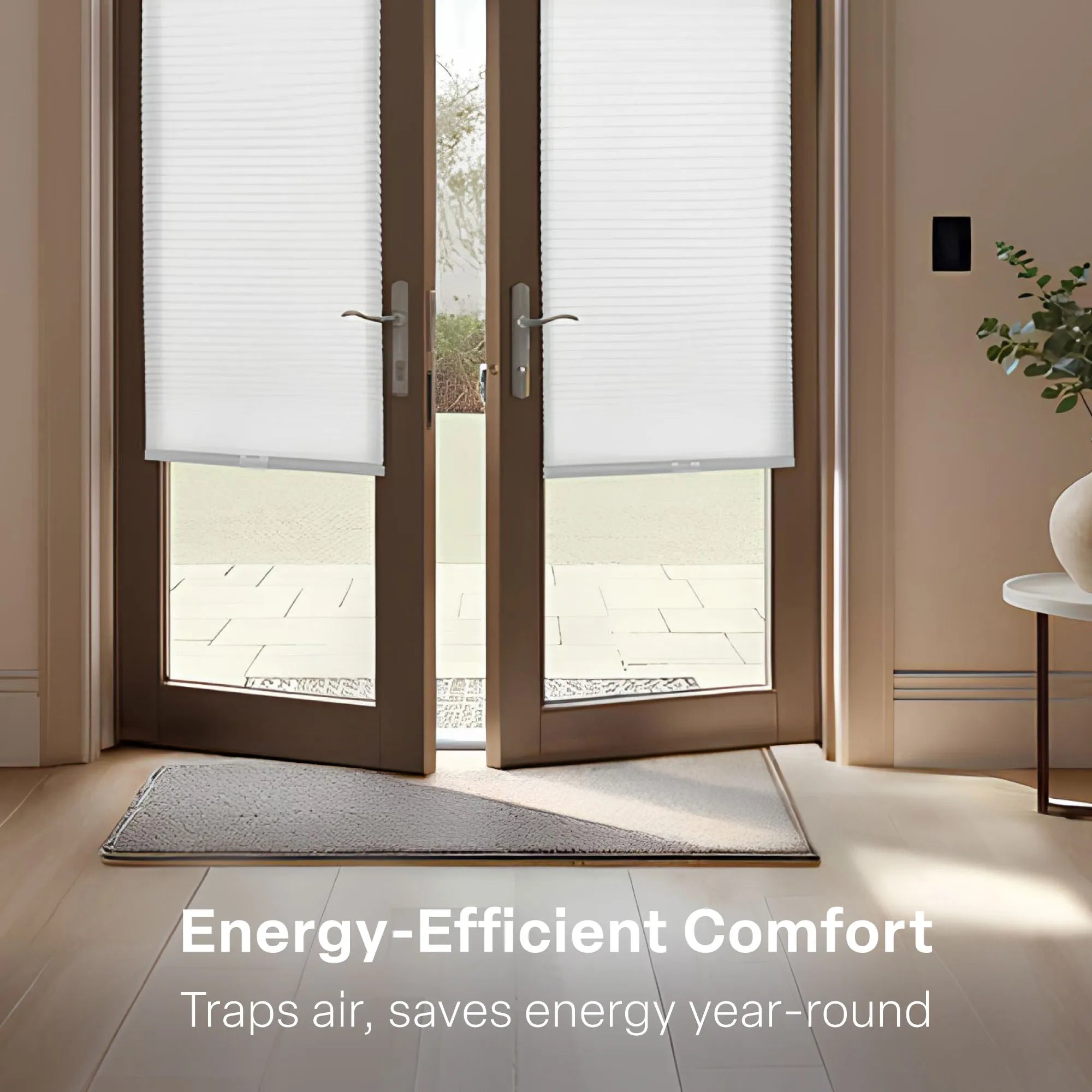 A bright, modern entryway with brown double French doors partially open. The glass panes are fitted with white &