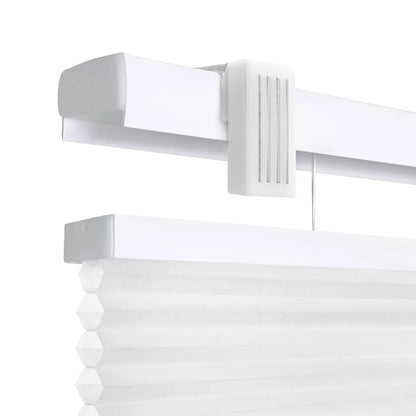 A high-resolution, close-up product shot of white cordless cellular honeycomb shades against a clean white background. The image highlights the top mounting rail and the textured, pleated fabric of the shade, showcasing the &