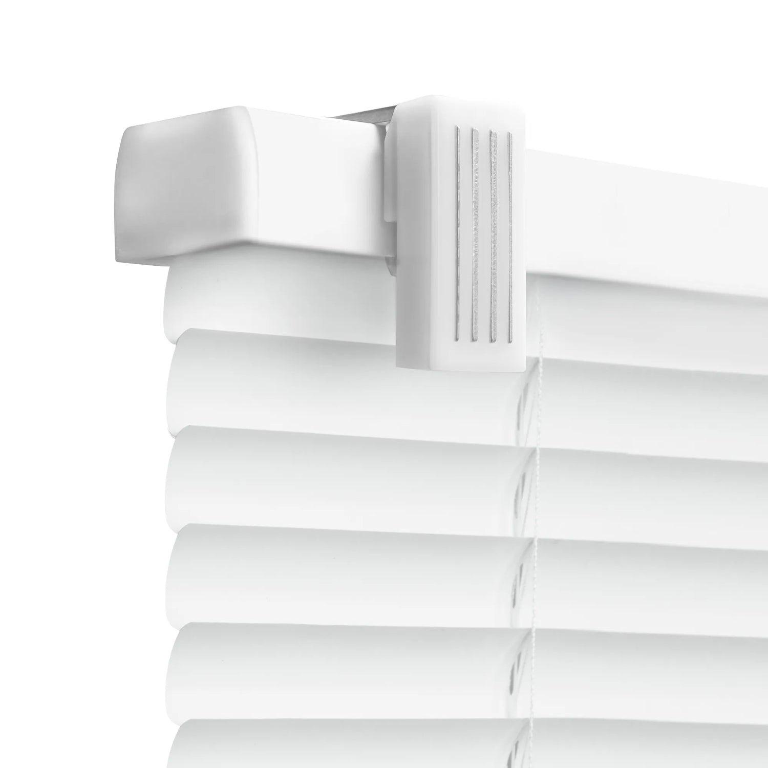 A close-up, high-angle shot of the top corner of white horizontal Venetian blinds. The image highlights the white headrail and a plastic mounting bracket with a textured, ribbed surface. Below the headrail, several curved white slats are visible, held together by thin white cords against a plain white background.