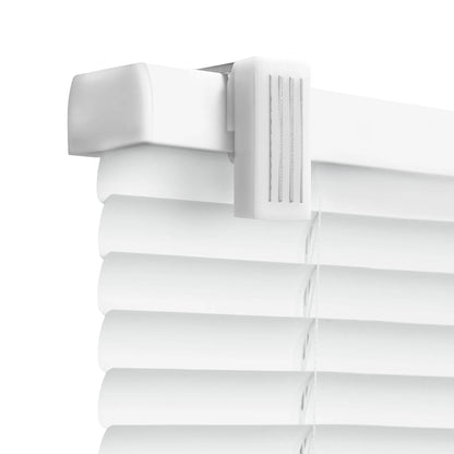 A close-up, high-angle shot of the top corner of white horizontal Venetian blinds. The image highlights the white headrail and a plastic mounting bracket with a textured, ribbed surface. Below the headrail, several curved white slats are visible, held together by thin white cords against a plain white background.